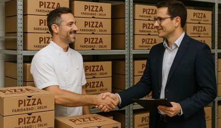 A pizza restaurant owner shaking hands with a local packaging supplier in a warehouse full of neatly stacked custom pizza boxes labeled ‘Faridabad | Delhi.’ Bright lighting, modern setting, and eco-friendly branding on boxes